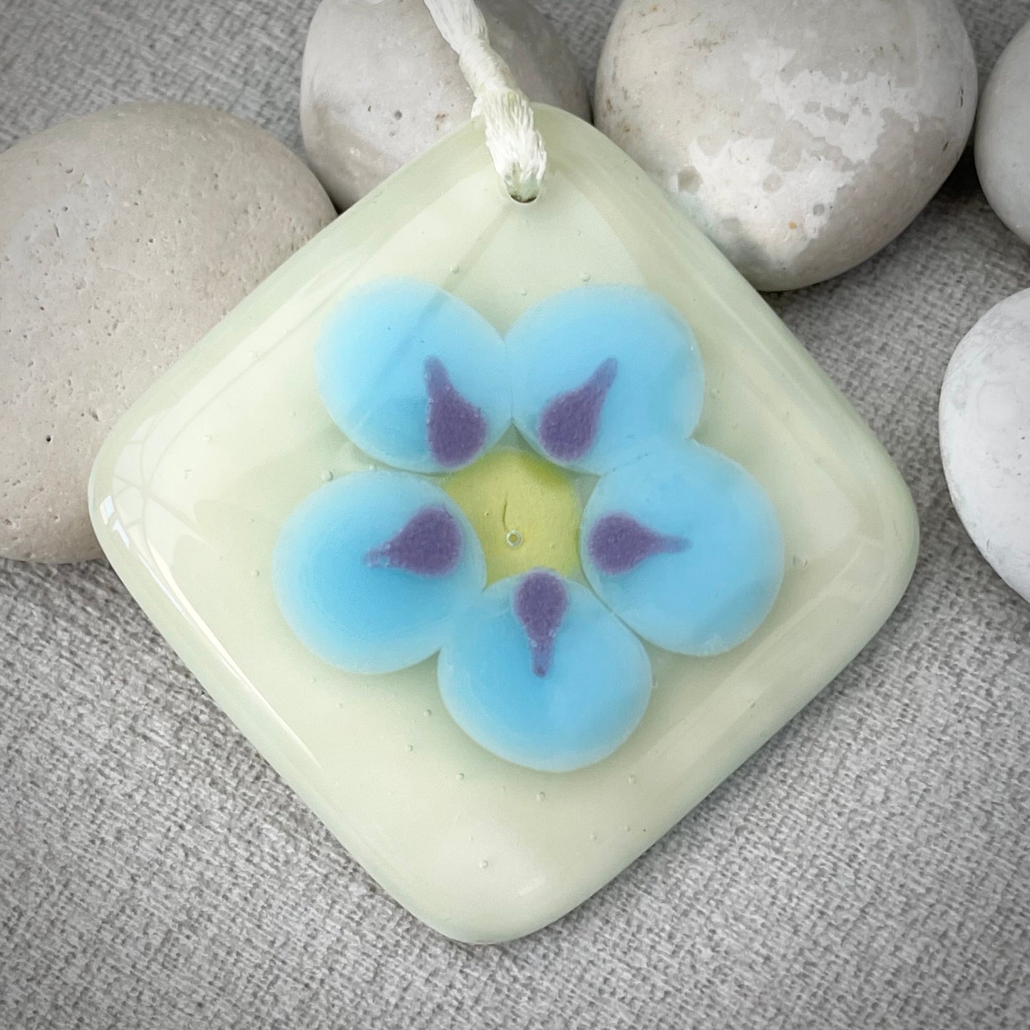 Fused glass forget-me-not token