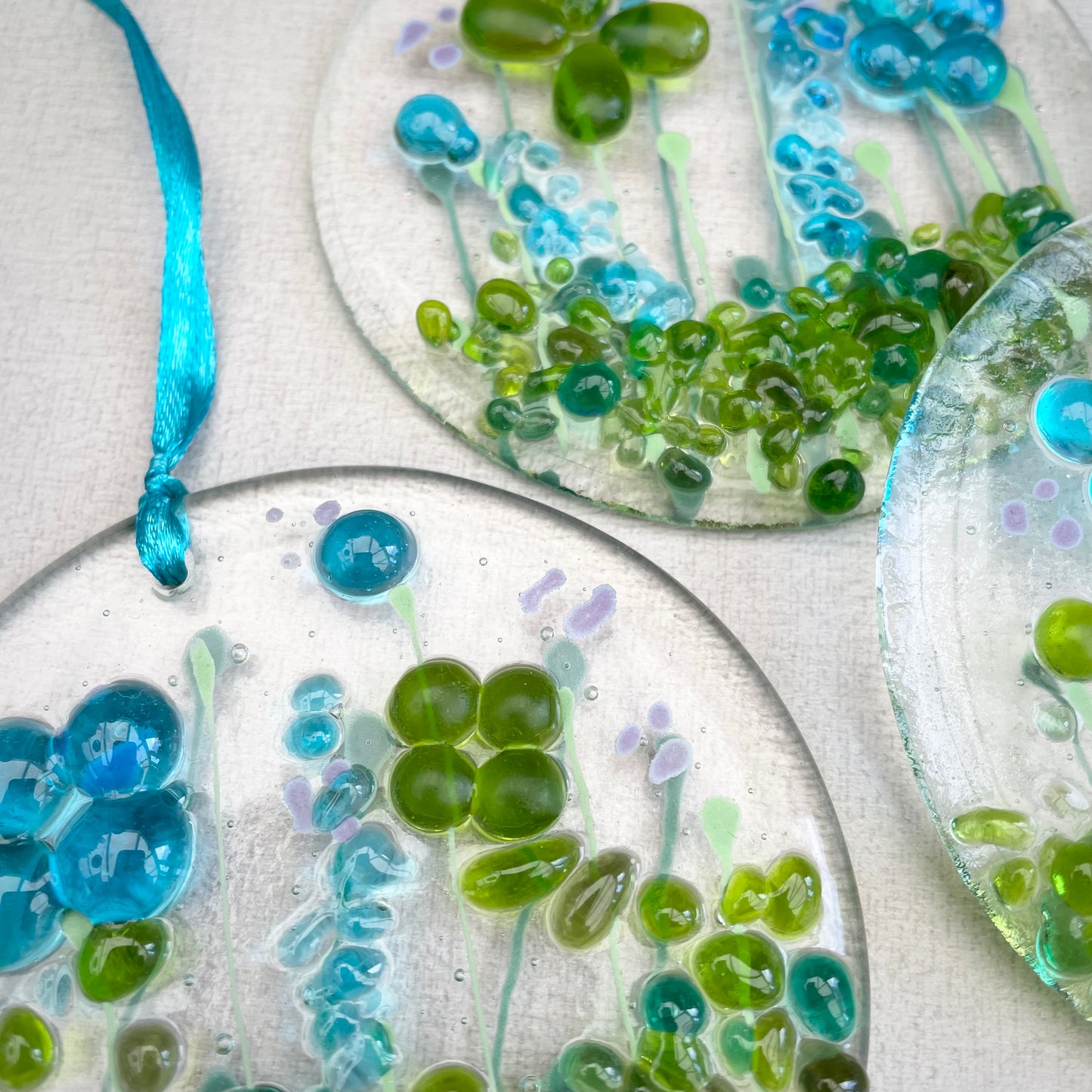 Fused glass window hanger in turquoise and lime green florals